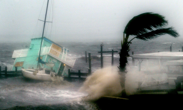 Hurricane Frances pounds houseboat against pier at Jensen Beach, which is east of Port St. Lucie, in 2004. Photo by J. Albert Diaz/ALM