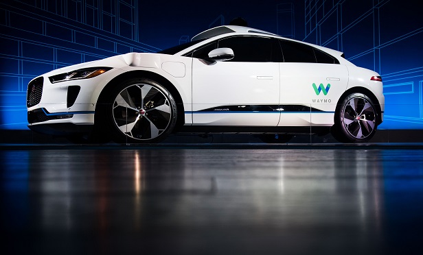 Some in the insurance industry believe that 'driverless cars are not ready for prime time in America.' Here,  Jaguar and Waymo introduced their I-Pace autonomous electric vehicle (EV) earlier this year in New York City. (Mark Kauzlarich/Bloomberg)