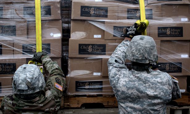 Soldiers move boxes