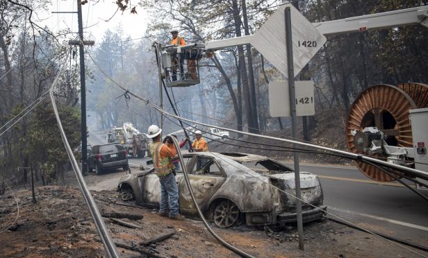 power line being repaired after wildfire.