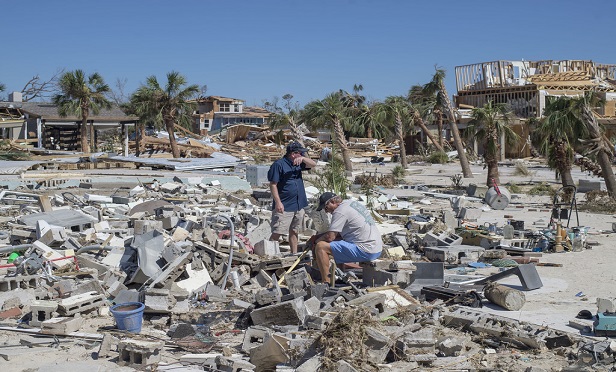 Natural disasters such as hurricanes, flooding and wildfires can strike even the most prepared homeowners and businesses. Here, residents survey debris after Hurricane Michael hit in Mexico Beach, Fla. (Zack Wittman/Bloomberg) 
