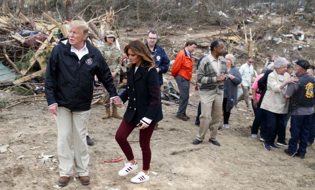 Trump visits areas of Alabama devastated by tornadoes.