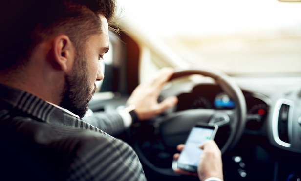 Distracted driving is more predictive of an eventual loss claim than virtually any other behavior, including speeding and braking. Those who tend to use cellphones at the wheel have 20% more insurance claims than others in the risk-pool, according to TrueMotion. (Photo: Shutterstock)