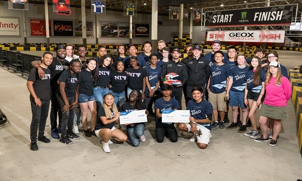 Argo Group presents a $10,000 check to two robotics teams from Long Island and Brooklyn, and $5,000 grant to a Queen's step team. (Photo: Brian Bowen)