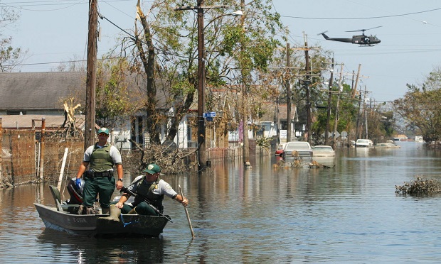 Officers from the Department of Wildlife Preservation search for flood victims in an area of St. Bernard Parish in New Orleans, Louisiana on Thursday, September 8, 2005. (Photo: Timothy Fadek/Bloomberg)