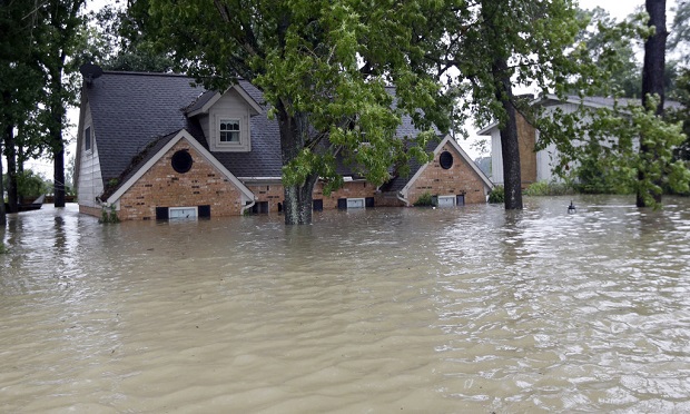 Digital tools make flood insurance more accessible to the market and help more people and businesses access this critical coverage. (AP Photo/David J. Phillip)