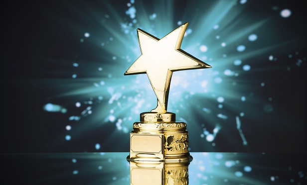 gold star trophy against blue sparks backgrounAgilius, Prostosure and Sigo took top honors in the 2020 InsurTech Competition. (iStock)
