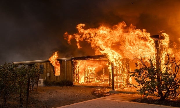 To develop a parametric insurance solution — one innovative way to address wildfire risk — a policy is structured with certain events plainly stated in order for coverage to be automatically triggered. (Photo: Phil Pacheco/Bloomberg)