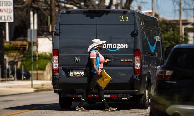 An Amazon Prime employee makes a delivery in Baltimore, MD. September 5, 2020.
