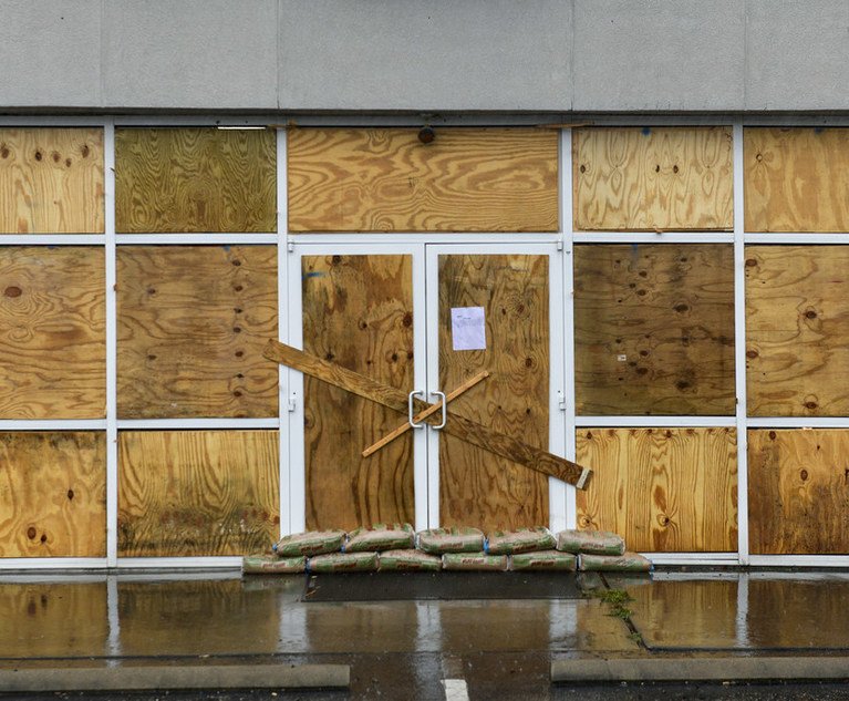 Plywood and sandbags secure the exterior of a business during Hurricane Dorian in Conway, South Carolina, U.S., on Thursday, Sept. 5, 2019. 