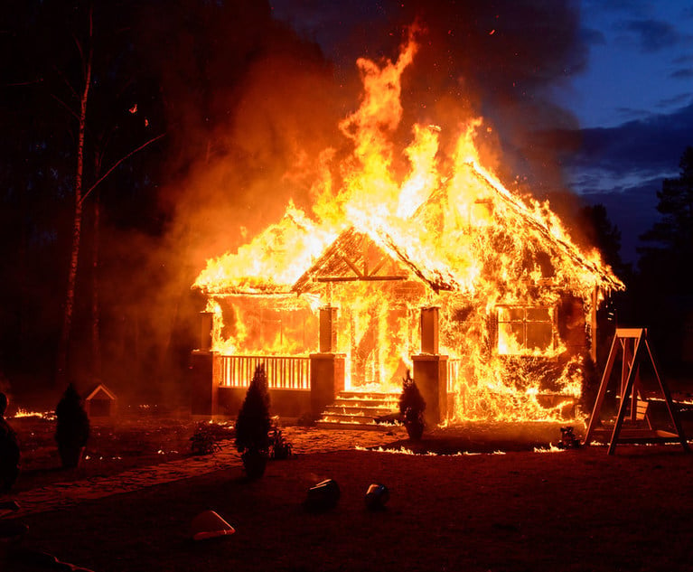 A house engulfed in flames.