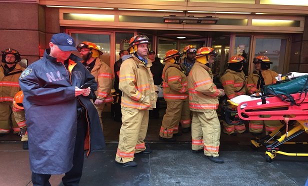 This New York Fire Department rescue team responded today to the helicopter crash at the AXA Equitable Center building. (Photo: David Handschuh/ALM)