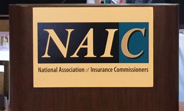 NAIC sign on a speaker's lectern
