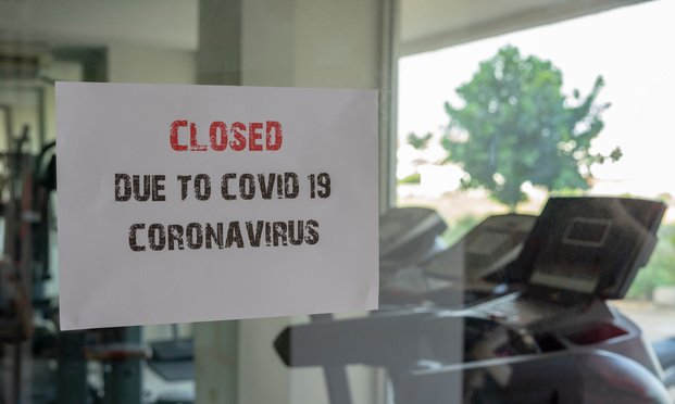 Closed due to Coronavirus on the door of a gym. Photo: Neptunestock/Shutterstock