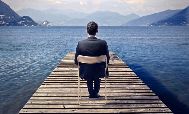 Man sitting on dock