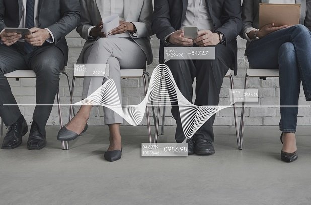 job candidates waiting in a row of chairs