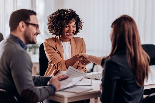 woman and man smiling at new hire