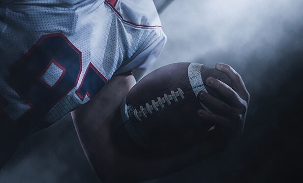 Insurer questions impact of athlete's injuries.