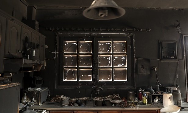 This charred kitchen was damaged during a deadly wildfire just east of Athens, Greece, in late July 2018. (Yorgos Karahalis/Bloomberg)