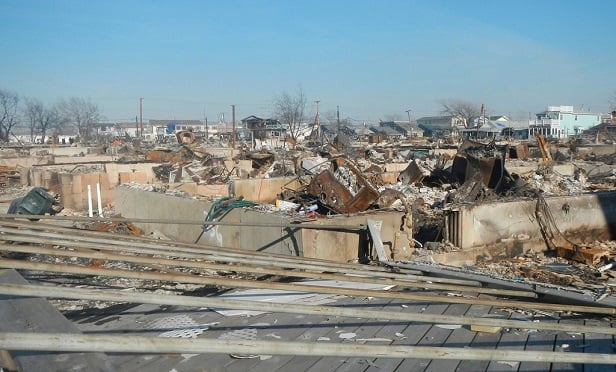 The cost to repair or replacement a damaged business will not include any increased cost attributable to enforcement of or compliance with any ordinance or law regulating the construction, use or repair of any property. This is Breezy Point in Queens after Hurricane Sandy and fires damaged the area. (New York Law Journal)