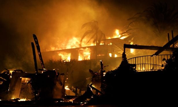 Home engulfed in fire from wildfire