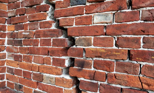 Cracked brick wall