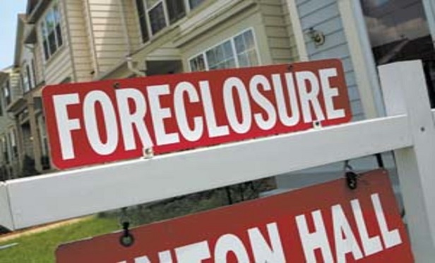 During the foreclosure process, homeowners' maintain an obligation to secure property insurance. (Newscom photo by Dennis Brack/Black Star)