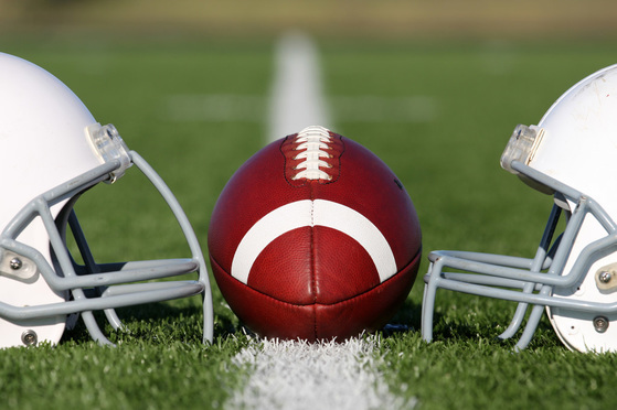 American Football and Helmets on the Field