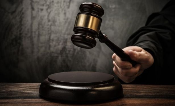 Judge with gavel.