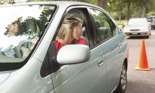Teen driver taking driving test.