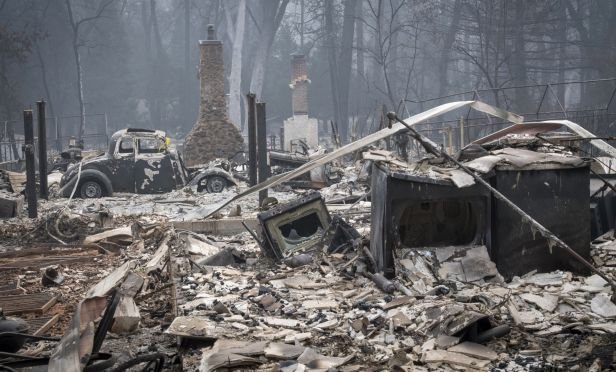 Burned-out homes and a vehicle