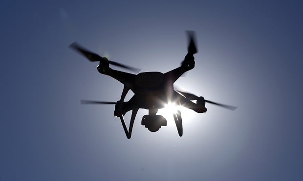A Da-Jiang Innovations Science and Technology Co. (DJI) Phantom drone is flown during a property inspection following Hurricane Harvey in Houston. (Photo: Luke Sharrett/Bloomberg)