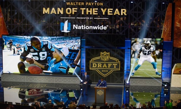 The 2014 Walter Payton Man of the Year award winner Carolina Panthers linebacker Thomas Davis speaks during the first round of the 2015 NFL Football Draft. (Photo: AP Photo/Paul Beaty)