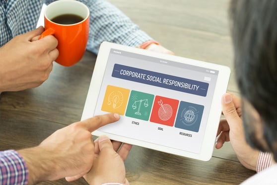 hands-holding-tablet-corporate-social-responsibility