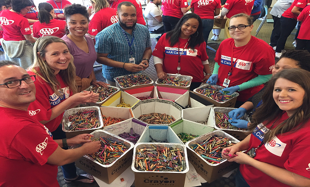 CSAA Insurance Group employees volunteer at The Crayon Initiative, one of the nonprofits the company partners with. (Photo: Courtesy of CSAA Insurance Group)