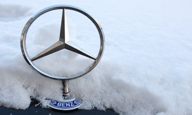 Increasingly turbulent weather in Germany's south is just another sign of Europe's largest economy getting ruffled by climate change. Here, a Mercedes-Benz star logo stands on a snow-covered automobile in Berlin, Germany. (Photographer: Adam Berry/Bloomberg News)
