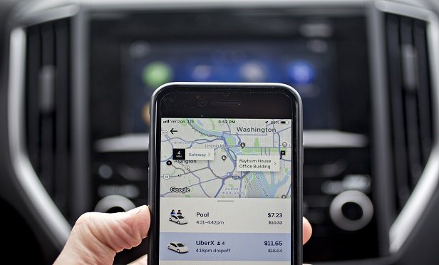 The protests will be familiar to anyone who was following Lyft Inc.'s IPO, which valued the business at $25 billion in March. (Photo: Andrew Harrer/Bloomberg)