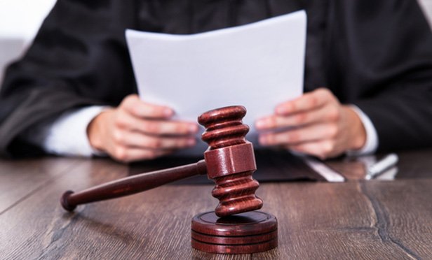 Male judge reading verdict