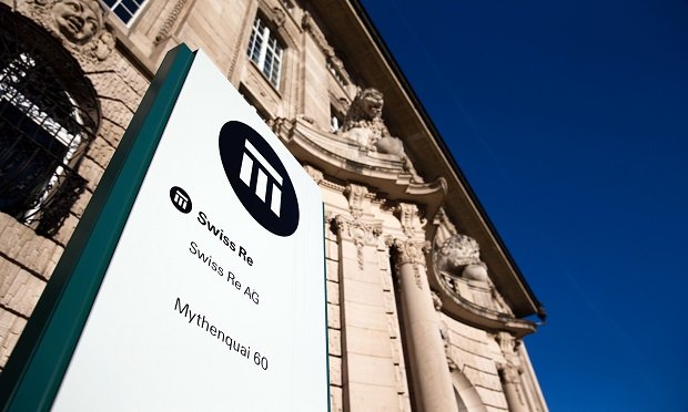 A logo sits on a sign outside Swiss Re AG's headquarters in Zurich, Switzerland. (Photo: Philipp Schmidli/Bloomberg)