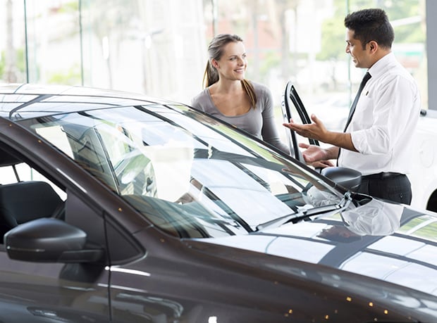 Young-woman-getting-ready-to-test-drive-new car