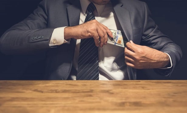 Evidence obtained by investigators revealed that victims' funds were deposited into Fortis Financial and Legacy Group Financial, and no WCMSA accounts were ever established. (Credit: Atstock Productions/Shutterstock)