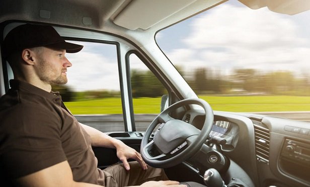 Besides the long hours behind the wheel, other injuries to drivers are often due to the fact that semi-trucks are like mobile warehouses, with drivers performing a wide variety of duties in and around the tractor-trailer and its cargo, often in adverse weather or road conditions. (Credit: Andrey Popov/Shutterstock)