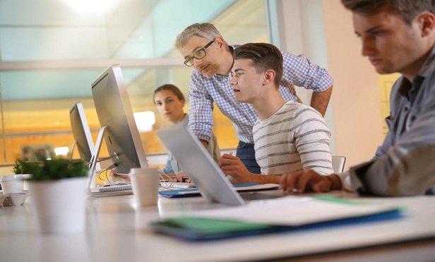 Zurich apprentices attend classes two days a week at Harper College and work three days a week at Zurich's Schaumburg, Ill., headquarters, rotating through different areas. (Credit: goodluz/Shutterstock)