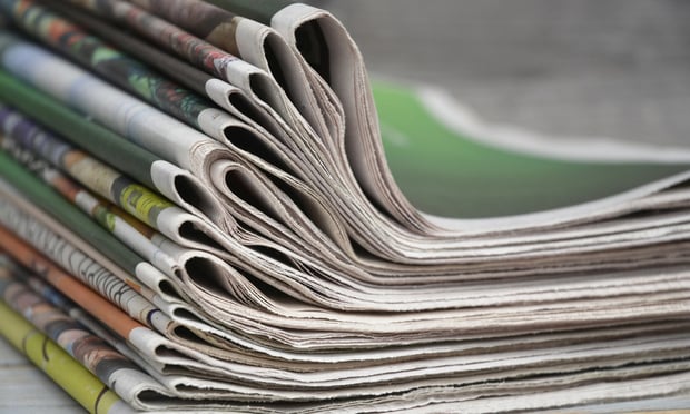 stack-of-folded-newspapers