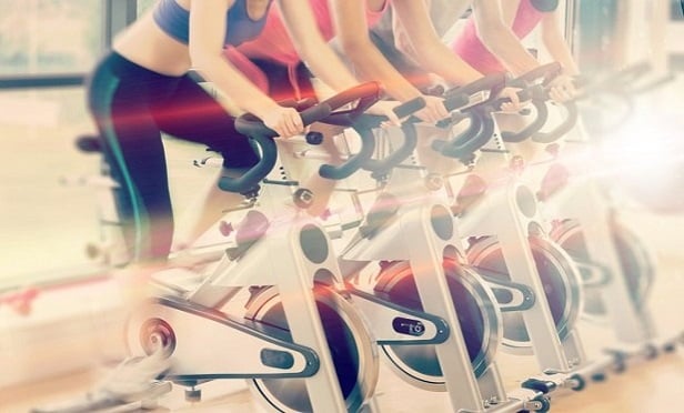 Wellness programs often encourage employees to partake in activities together, as workout buddies, accountability partners and participants in group fitness classes. This camaraderie means employees get to know each other better, and those enhanced relationships translate into better teamwork. (Credit: vectorfusionart/Shutterstock) 