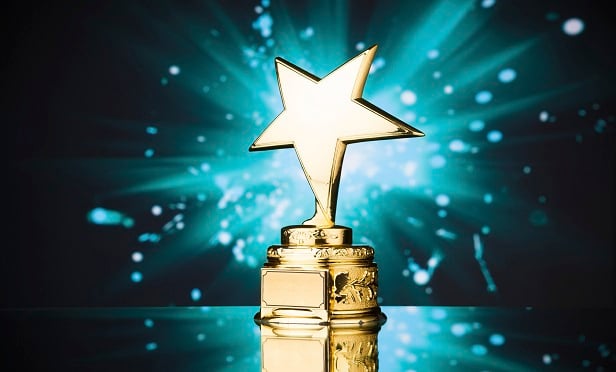 gold star trophy against blue sparks backgrounAgilius, Prostosure and Sigo took top honors in the 2020 InsurTech Competition. (iStock)