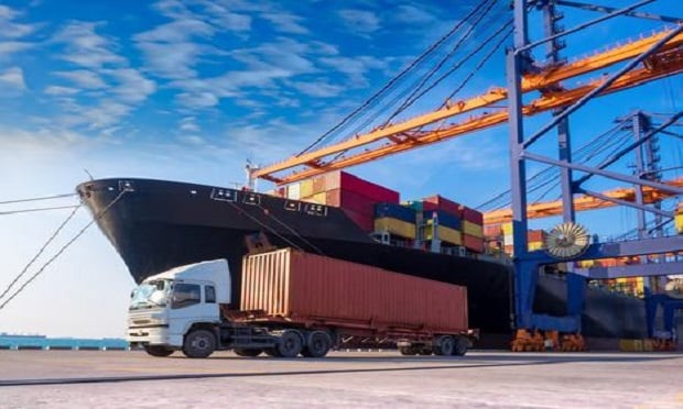 A container vessel during discharging at an industrial port. (Photo: Mr. Amarin Jitnathum/Shutterstock)