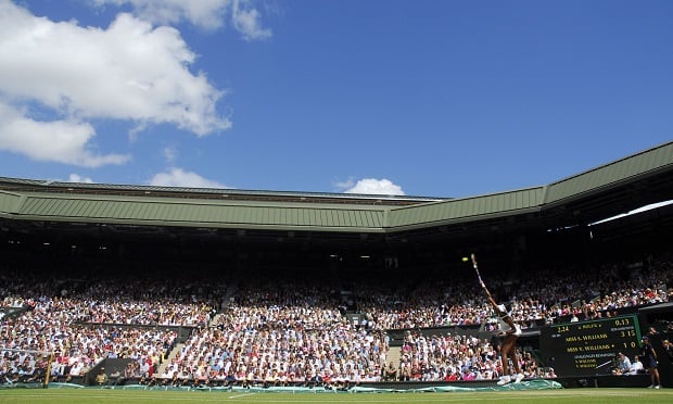 Venus Williams serves the ball to her sister, Serena Williams, during their finals match at the Wimbledon tennis championships in southwest London, U.K., on Saturday, July 5, 2008. (Photo: Alan Crowhurst/Bloomberg)