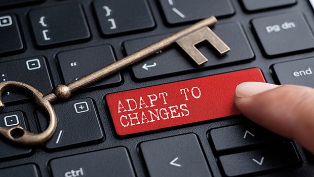 Skeleton key on computer keyboard that says adapt change