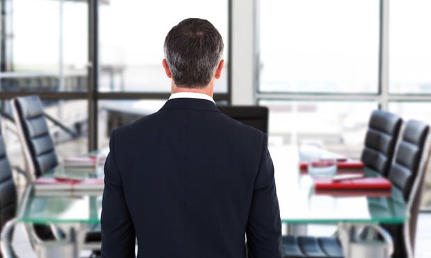 Rear view of businessman in empty conference room
